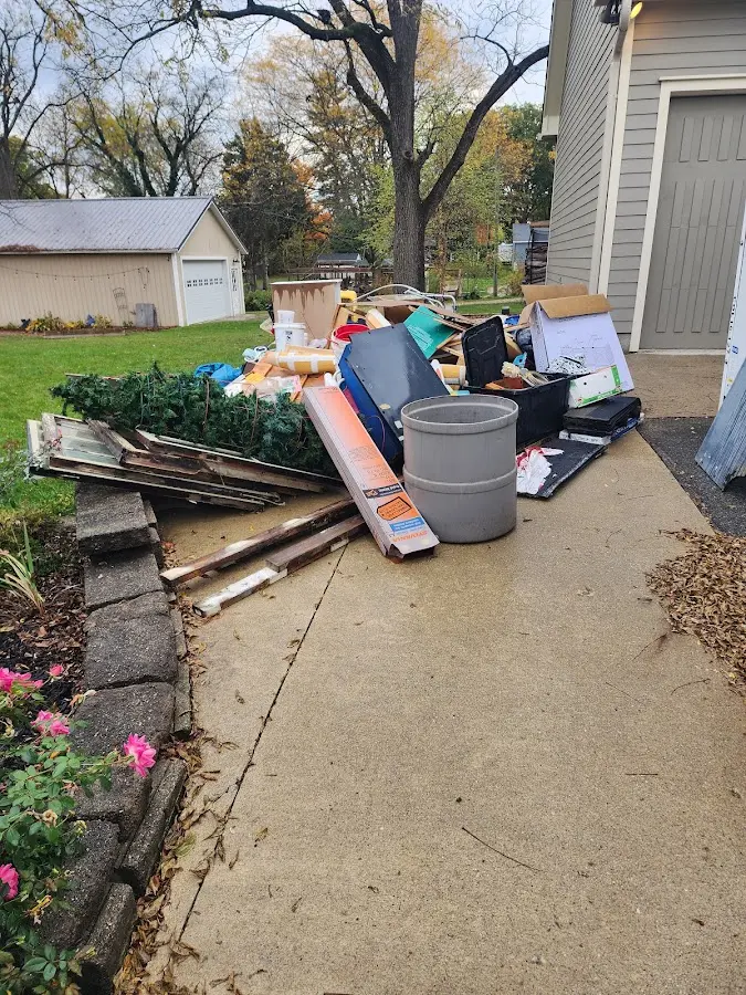 Dumpster being loaded with debris for 10 Yard Dumpster Rental in Putnam